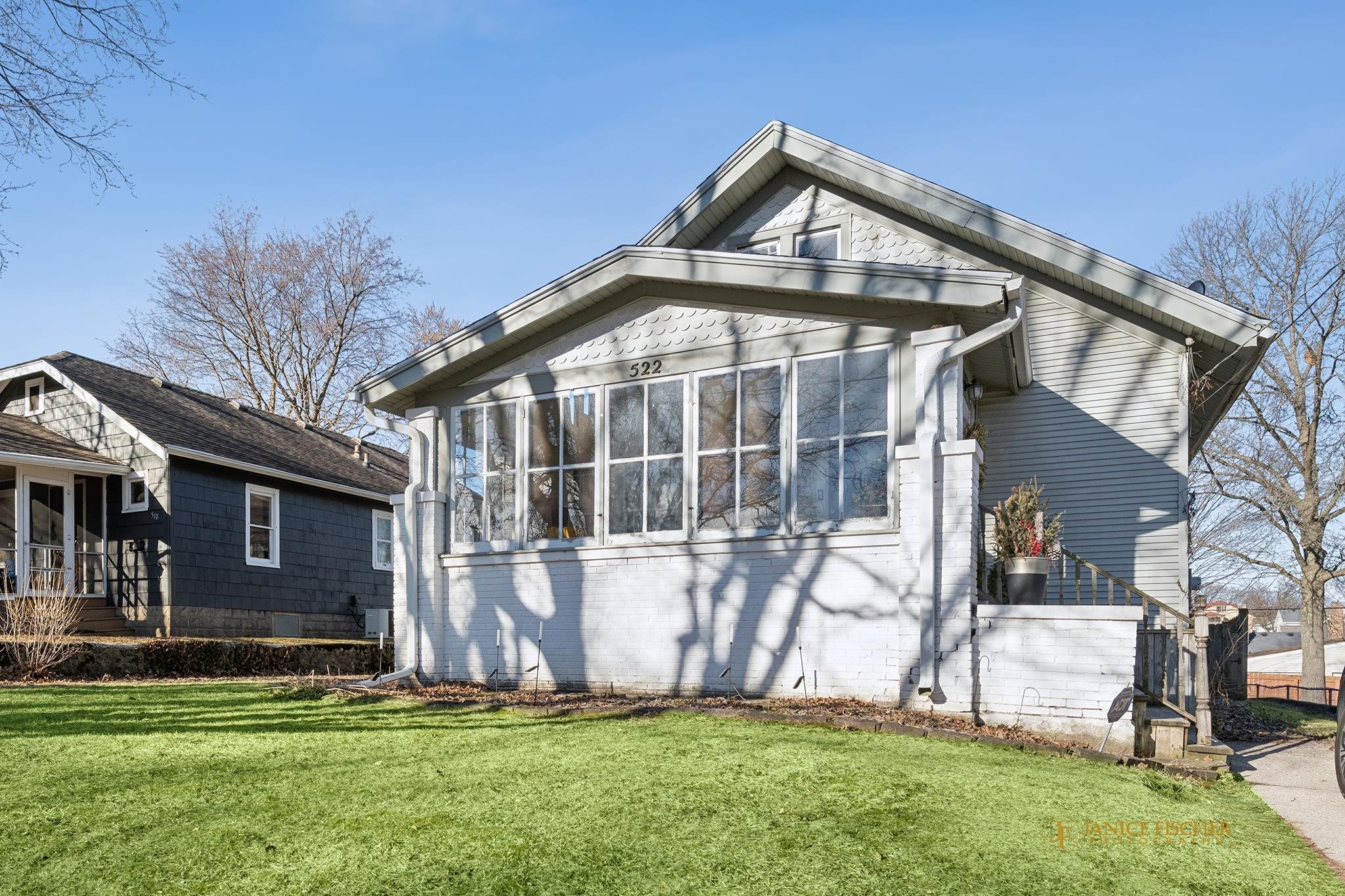 522 Rome Avenue Rockford, IL 61107 - Photo 1 of 13 a front view of a house with a yard