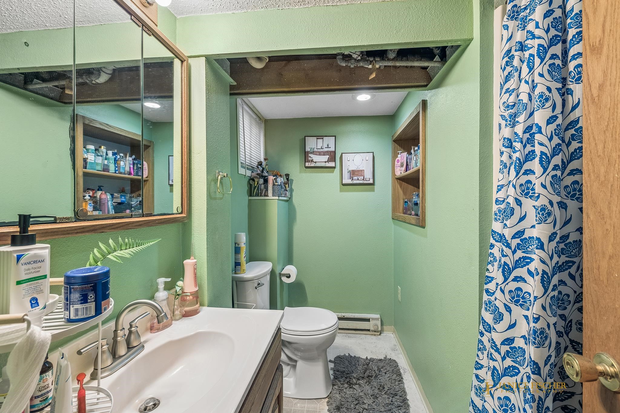 522 Rome Avenue Rockford, IL 61107 - Photo 12 of 13 a bathroom with a sink toilet and shower
