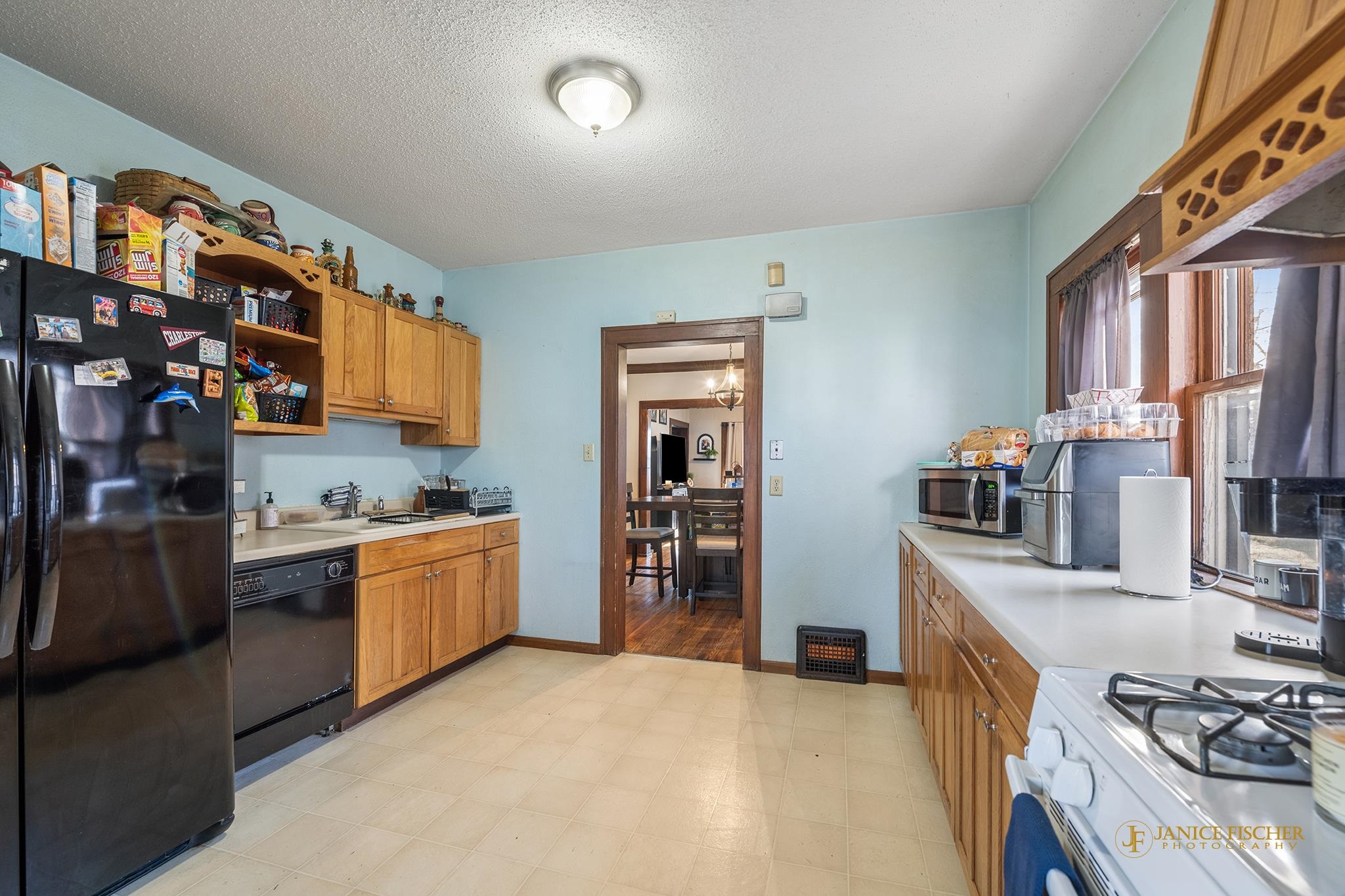 522 Rome Avenue Rockford, IL 61107 - Photo 6 of 13 a kitchen with stainless steel appliances granite countertop a stove a sink and a refrigerator
