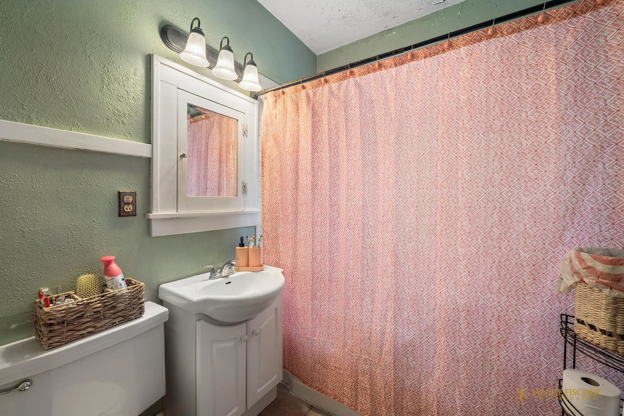 522 Rome Avenue Rockford, IL 61107 - Photo 8 of 13 a bathroom with a sink and a mirror