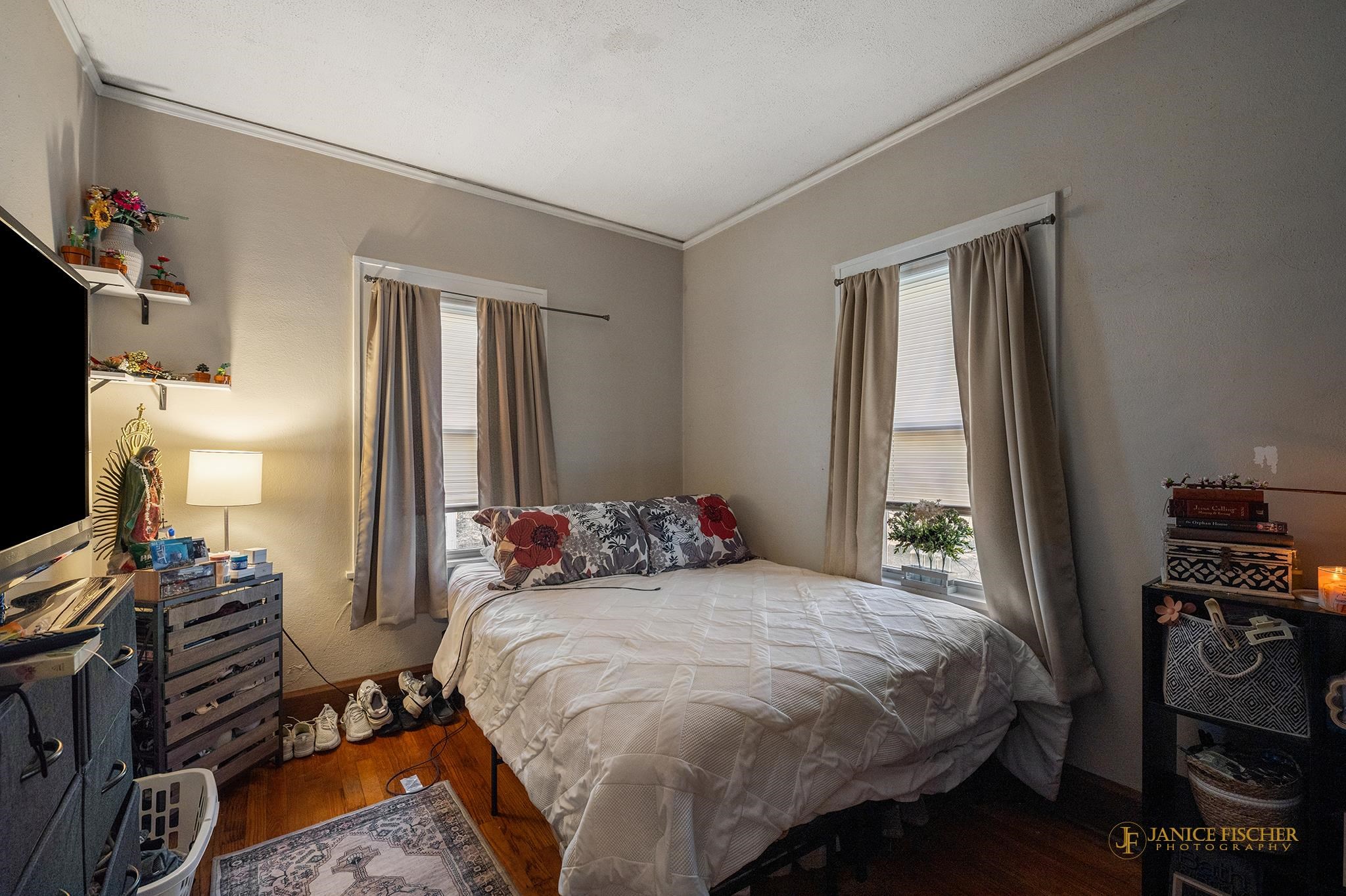 522 Rome Avenue Rockford, IL 61107 - Photo 9 of 13 a bedroom with a bed and wooden floor