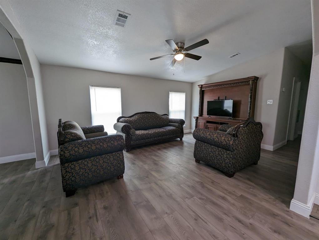 701 Rumage Road Jacksboro, TX 76458 - Photo 12 of 15 a living room with furniture and a flat screen tv