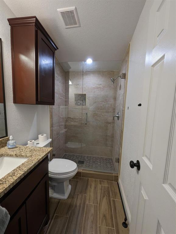 701 Rumage Road Jacksboro, TX 76458 - Photo 13 of 15 a bathroom with a sink a toilet and shower