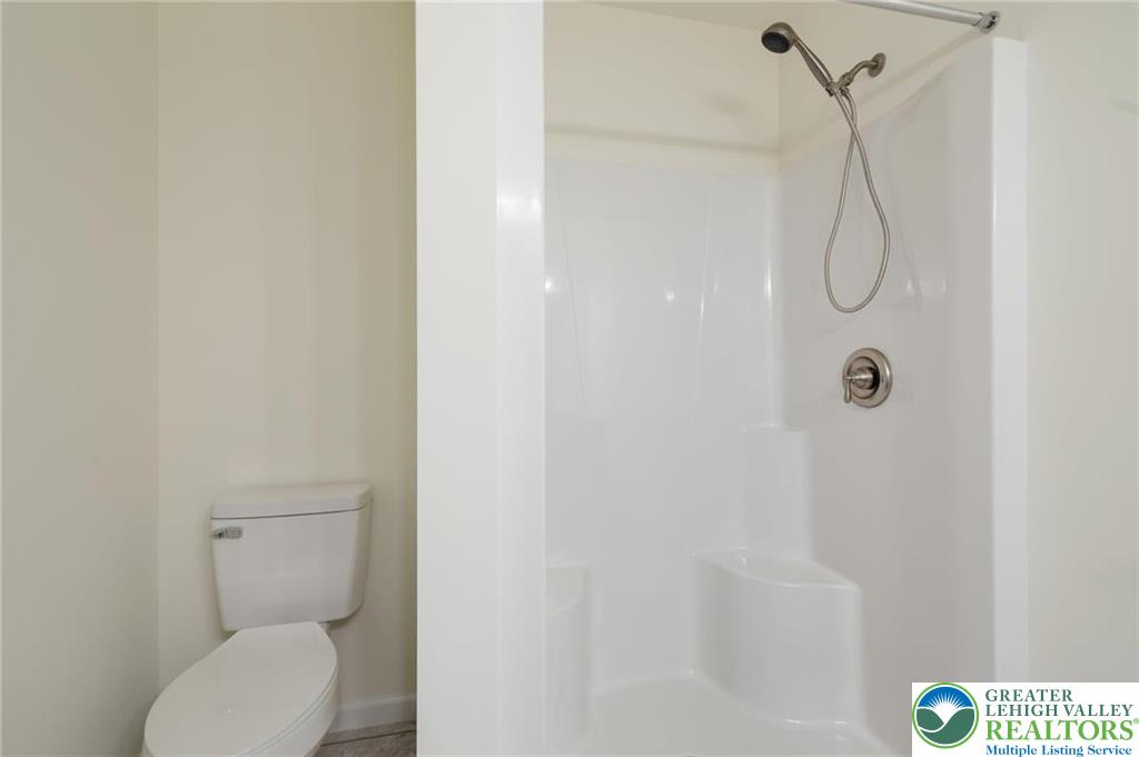 16 Ricks Road New Ringgold, PA 17960 - Photo 10 of 15 a bathroom with a granite countertop toilet and a shower
