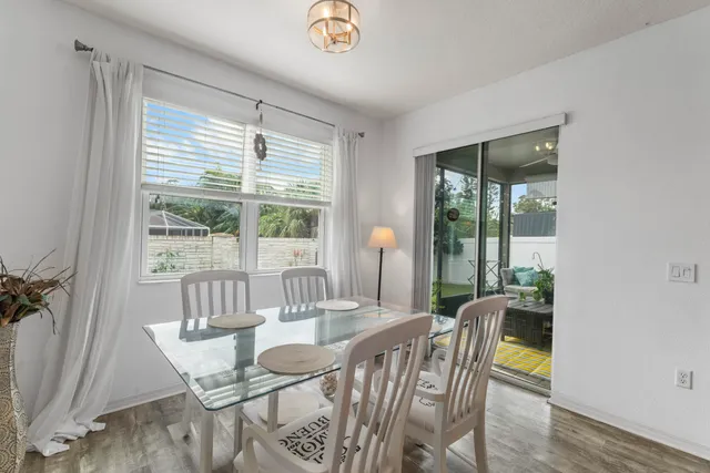 a spacious bedroom with a bed and a chandelier