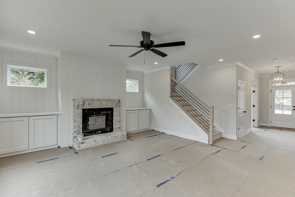 173 Swimming Pool Road Buford, GA 30518 - Photo 11 of 35 a view of a livingroom with a fireplace and hallway