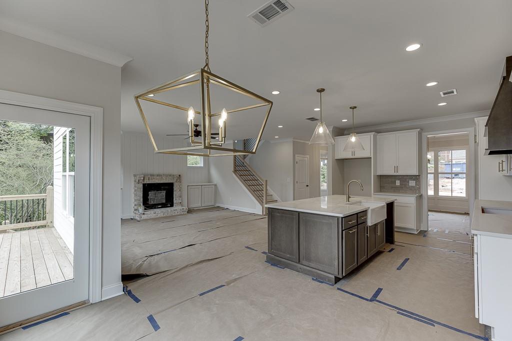 173 Swimming Pool Road Buford, GA 30518 - Photo 19 of 35 a view of kitchen and sink with large windows