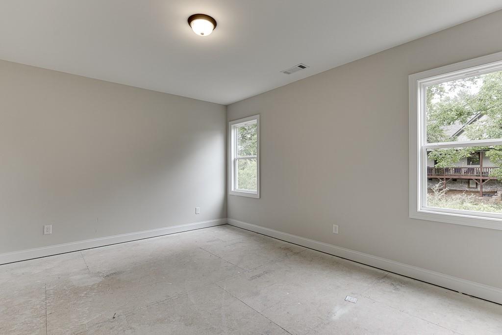 173 Swimming Pool Road Buford, GA 30518 - Photo 22 of 35 a view of an empty room with a window