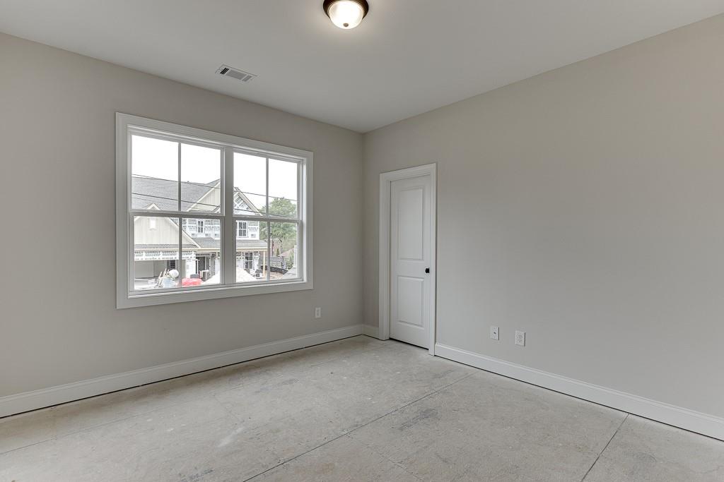 173 Swimming Pool Road Buford, GA 30518 - Photo 26 of 35 an empty room with a window