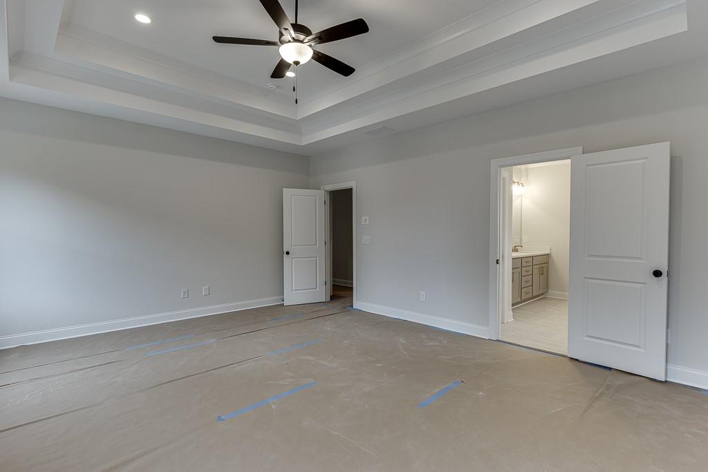 173 Swimming Pool Road Buford, GA 30518 - Photo 30 of 35 a view of an empty room and chandelier fan