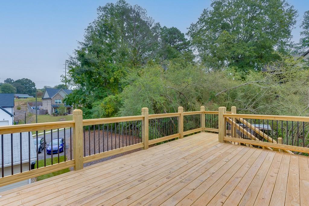 173 Swimming Pool Road Buford, GA 30518 - Photo 34 of 35 a view of balcony with wooden floor and fence