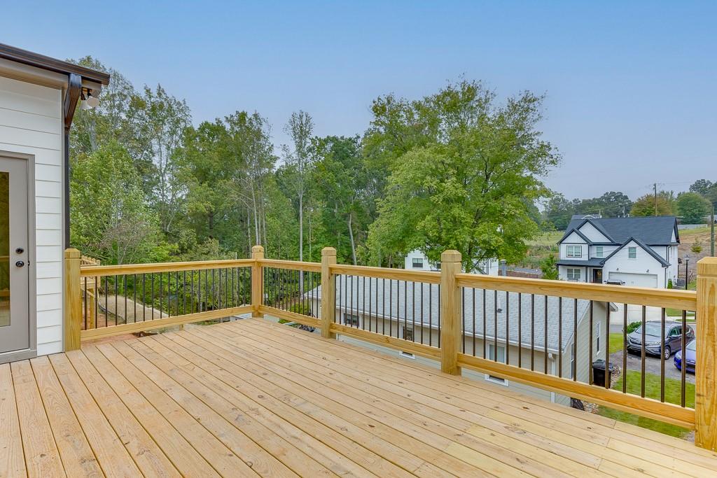 173 Swimming Pool Road Buford, GA 30518 - Photo 35 of 35 a view of balcony with wooden floor and fence