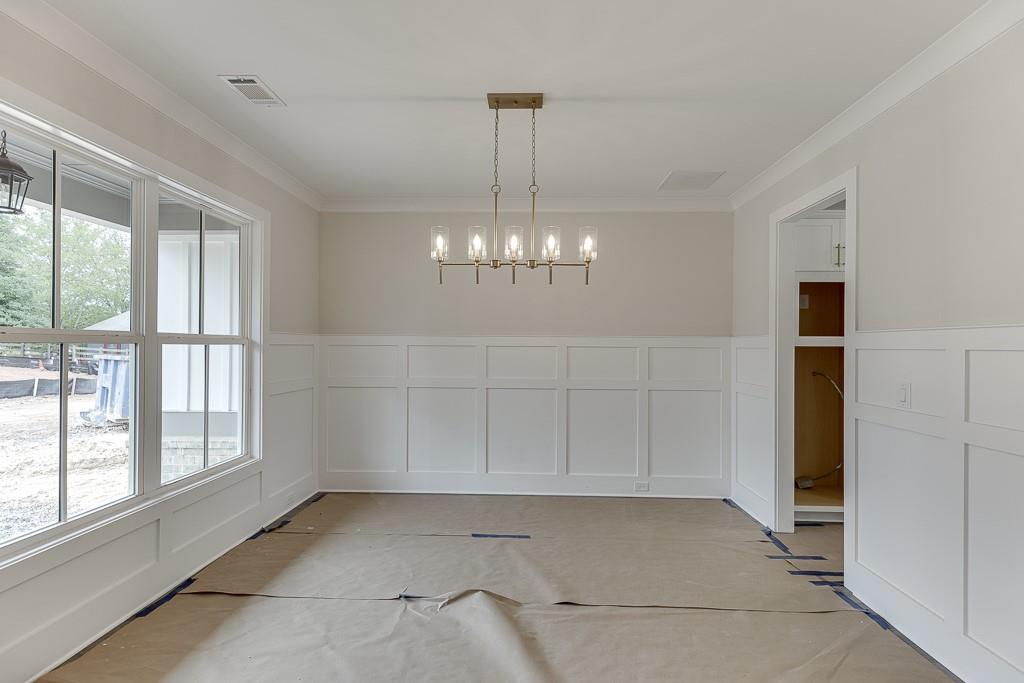 173 Swimming Pool Road Buford, GA 30518 - Photo 4 of 35 a view of a chandelier in a room