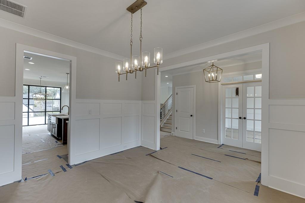 173 Swimming Pool Road Buford, GA 30518 - Photo 5 of 35 a view of a livingroom with a chandelier