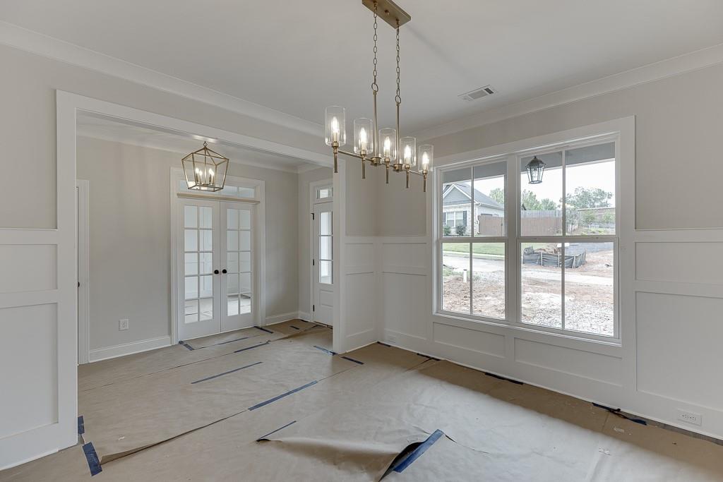 173 Swimming Pool Road Buford, GA 30518 - Photo 6 of 35 a view of a livingroom with a chandelier fan and windows