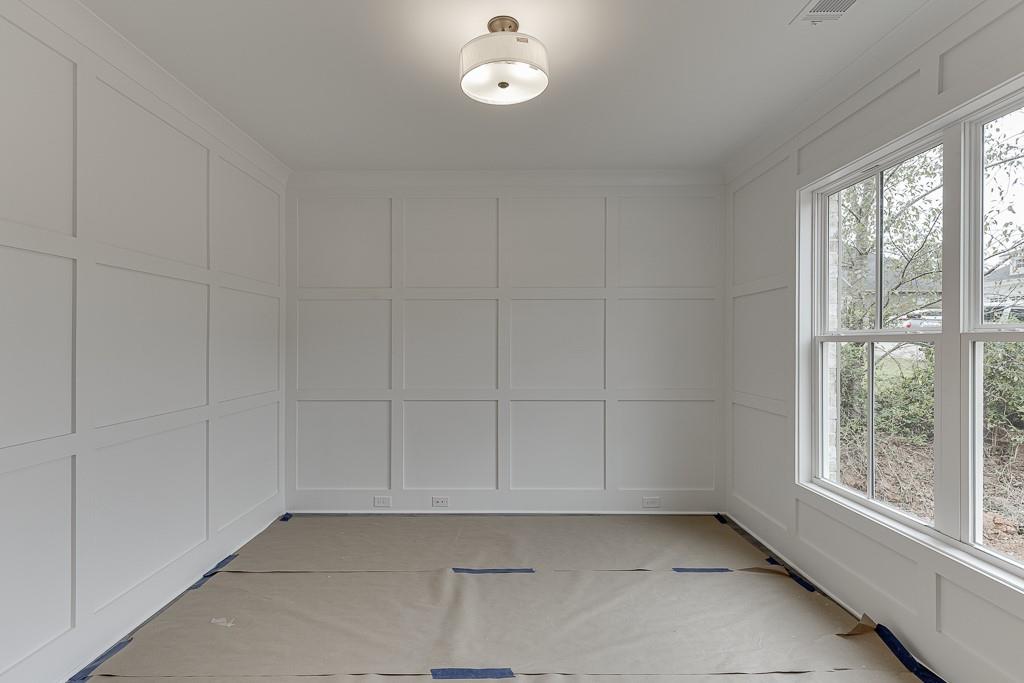 173 Swimming Pool Road Buford, GA 30518 - Photo 7 of 35 a view of an empty room with a window