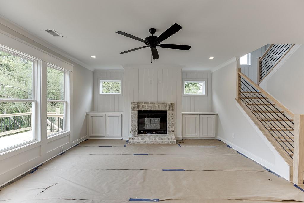 173 Swimming Pool Road Buford, GA 30518 - Photo 10 of 35 a view of a livingroom with a ceiling fan and window