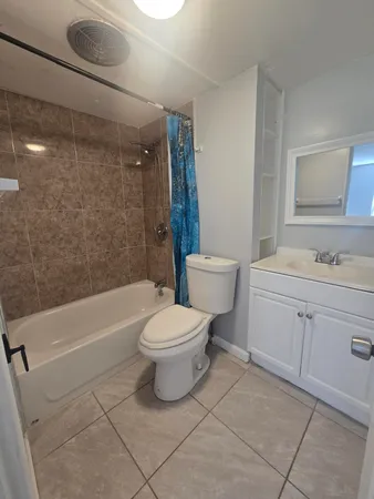 a bathroom with a toilet sink shower and bathtub