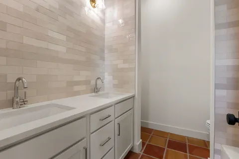 a bathroom with a sink and a shower
