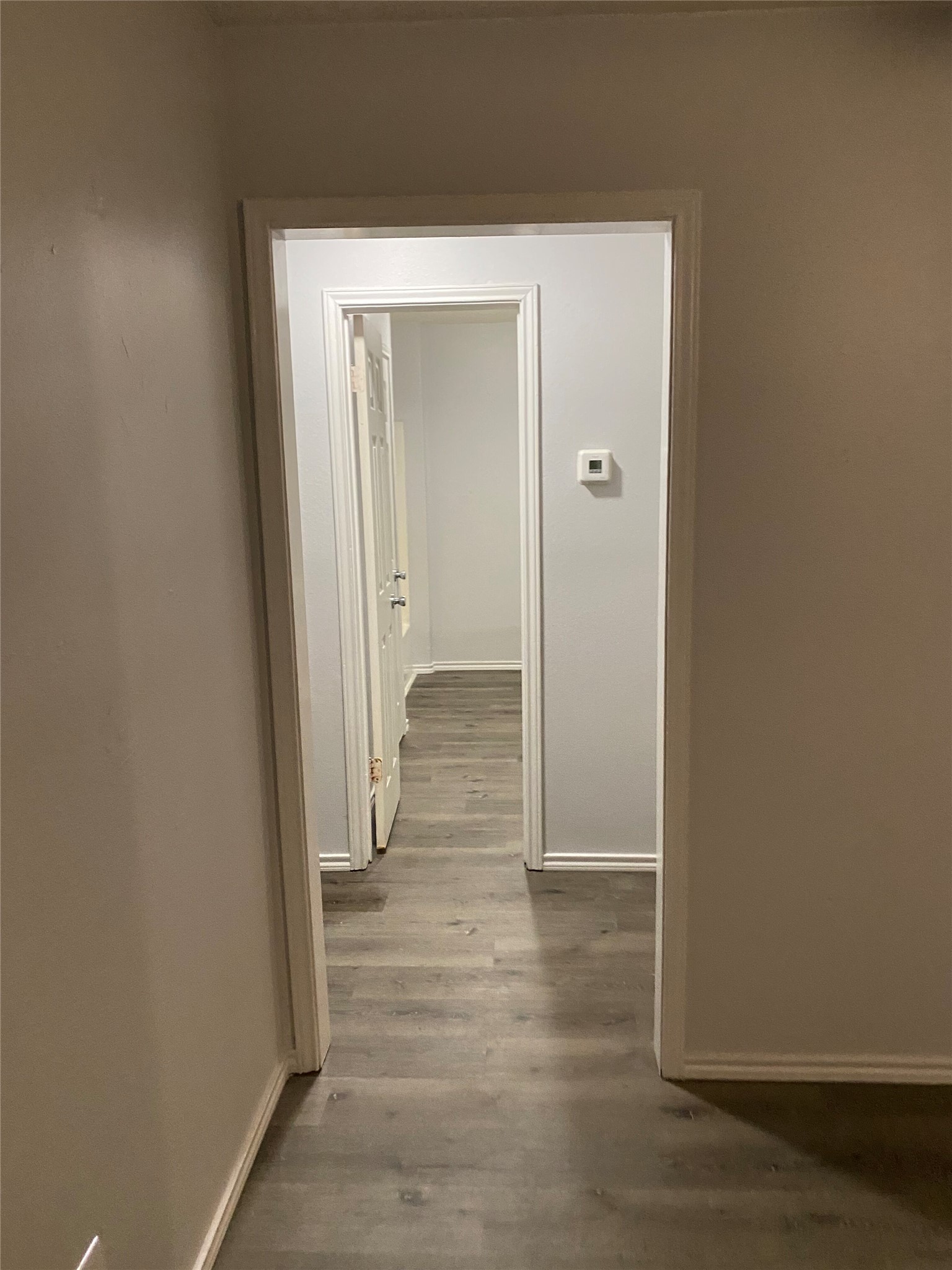 309 South Ave C, Unit A Elgin, TX 78621 - Photo 15 of 15 a view of a hallway with wooden floor