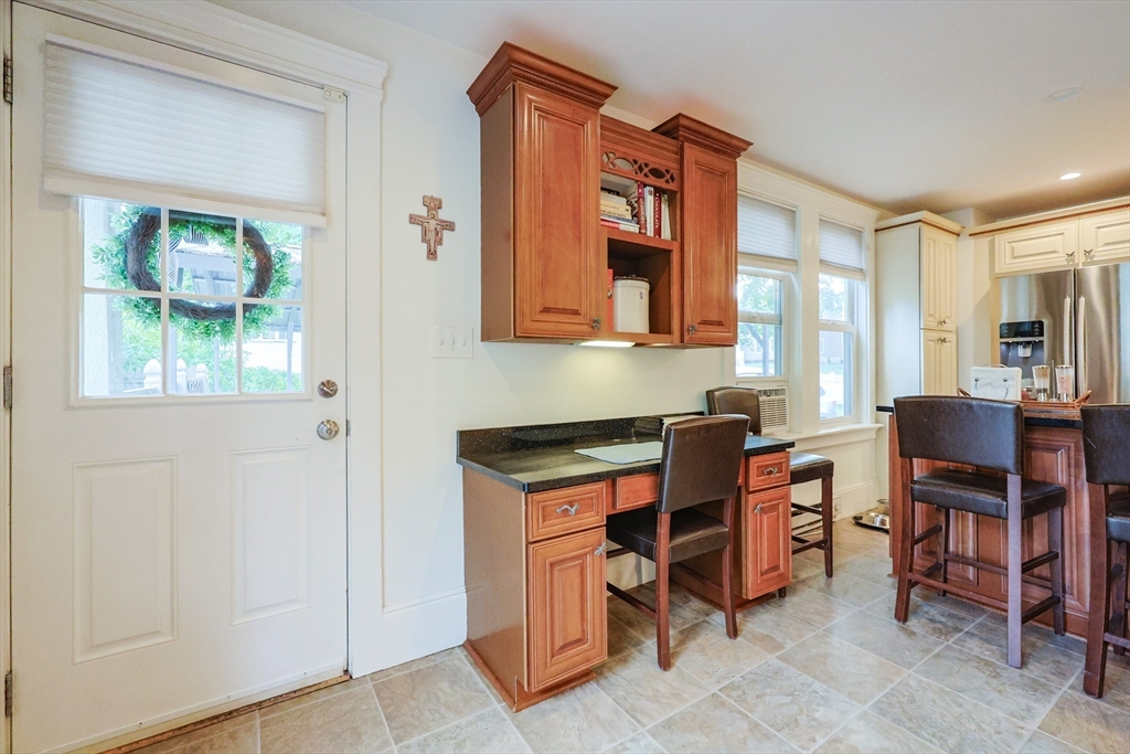 403 Main Street Clinton, MA 01510 - Photo 12 of 42 a view of a workspace with furniture and a window