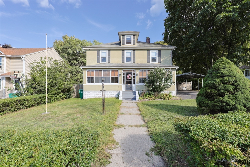 403 Main Street Clinton, MA 01510 - Photo 2 of 42 a front view of a house with garden