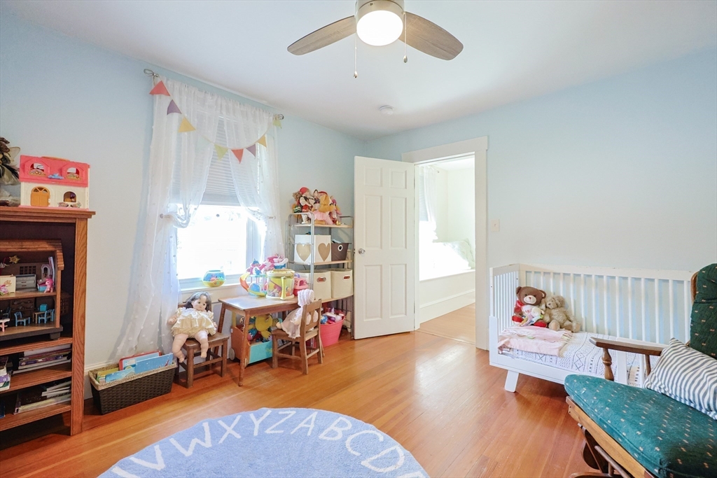 403 Main Street Clinton, MA 01510 - Photo 22 of 42 a bedroom with furniture and a gym equipment