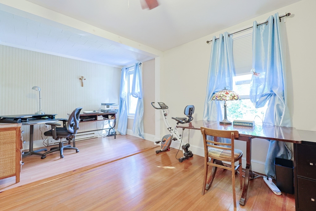 403 Main Street Clinton, MA 01510 - Photo 27 of 42 a living room with furniture and a wooden floor