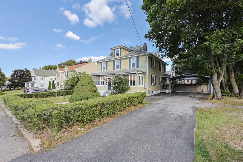 403 Main Street Clinton, MA 01510 - Photo 3 of 42 a view of a house with a yard and potted plants