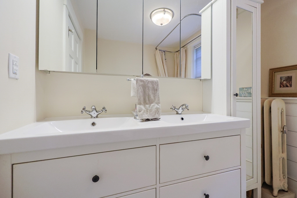 403 Main Street Clinton, MA 01510 - Photo 32 of 42 a bathroom with a sink and a mirror