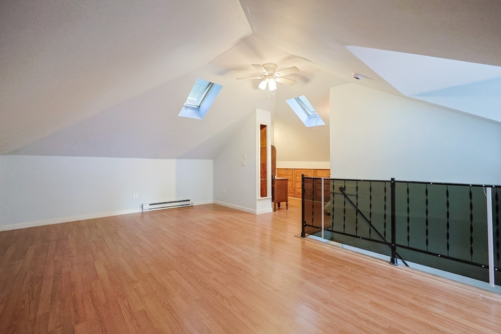 403 Main Street Clinton, MA 01510 - Photo 33 of 42 a view of an empty room with wooden floor