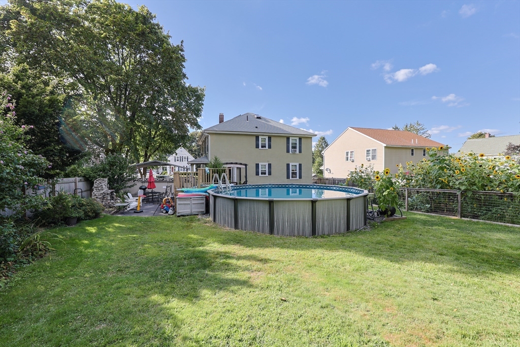 403 Main Street Clinton, MA 01510 - Photo 42 of 42 a view of a house with a yard and sitting area