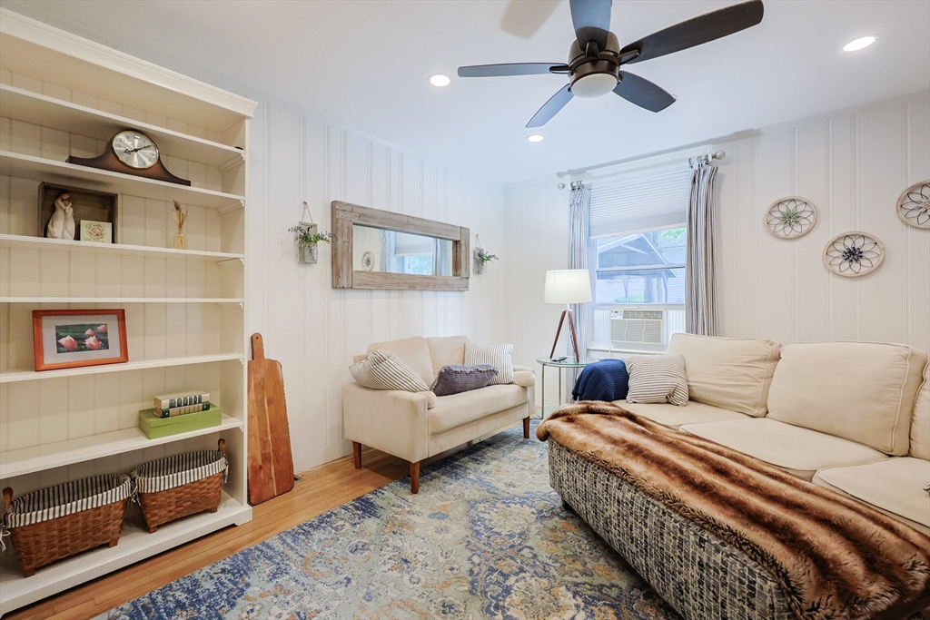 403 Main Street Clinton, MA 01510 - Photo 5 of 42 a living room with furniture and painting on the wall