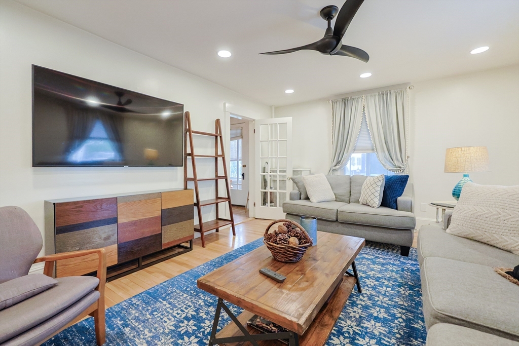 403 Main Street Clinton, MA 01510 - Photo 9 of 42 a living room with furniture and a rug