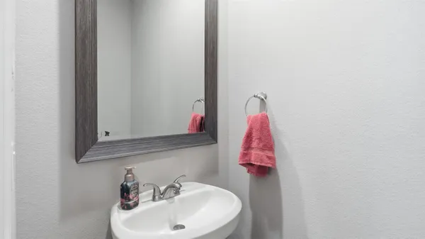 a bathroom with a sink and mirror