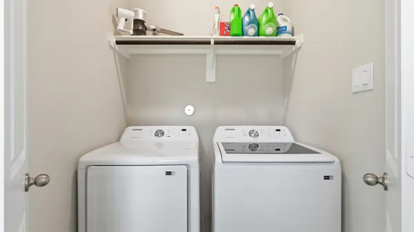 a utility room with dryer and washer