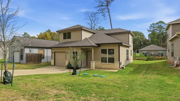 a front view of a house with a yard