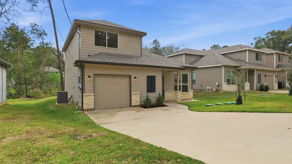 front view of a house with a yard