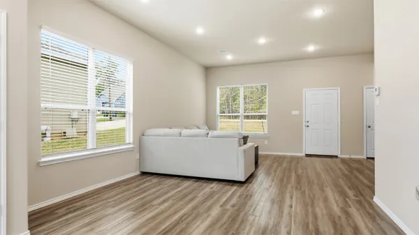 a living room with furniture and a window