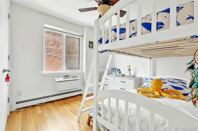 a bed room with a bed and a baby crib