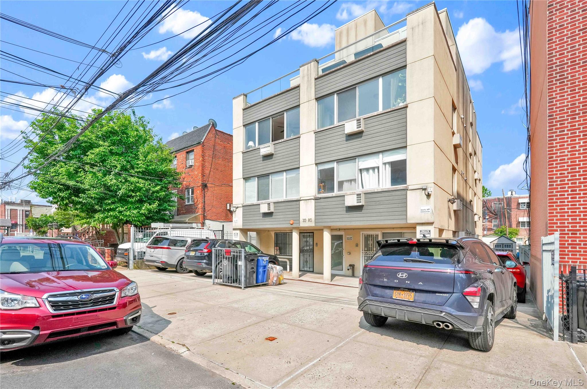 30-80 47th Street, Unit 3A Queens, NY 11103 - Photo 29 of 31 a car parked in front of a building