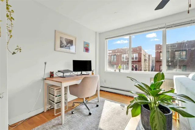 a workspace with furniture and a potted plant