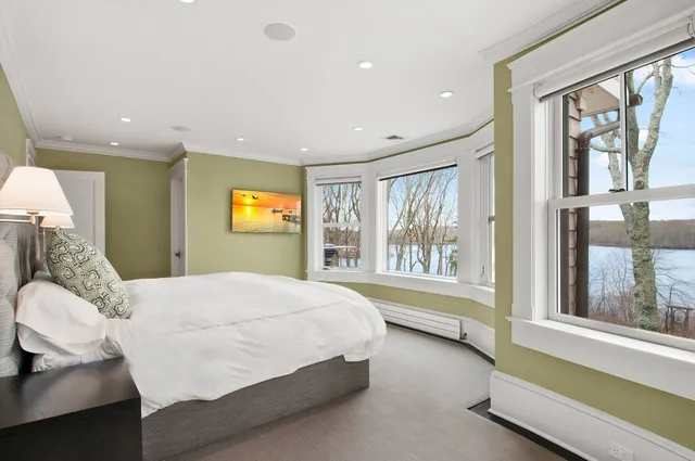 a large tub sitting in front of a window