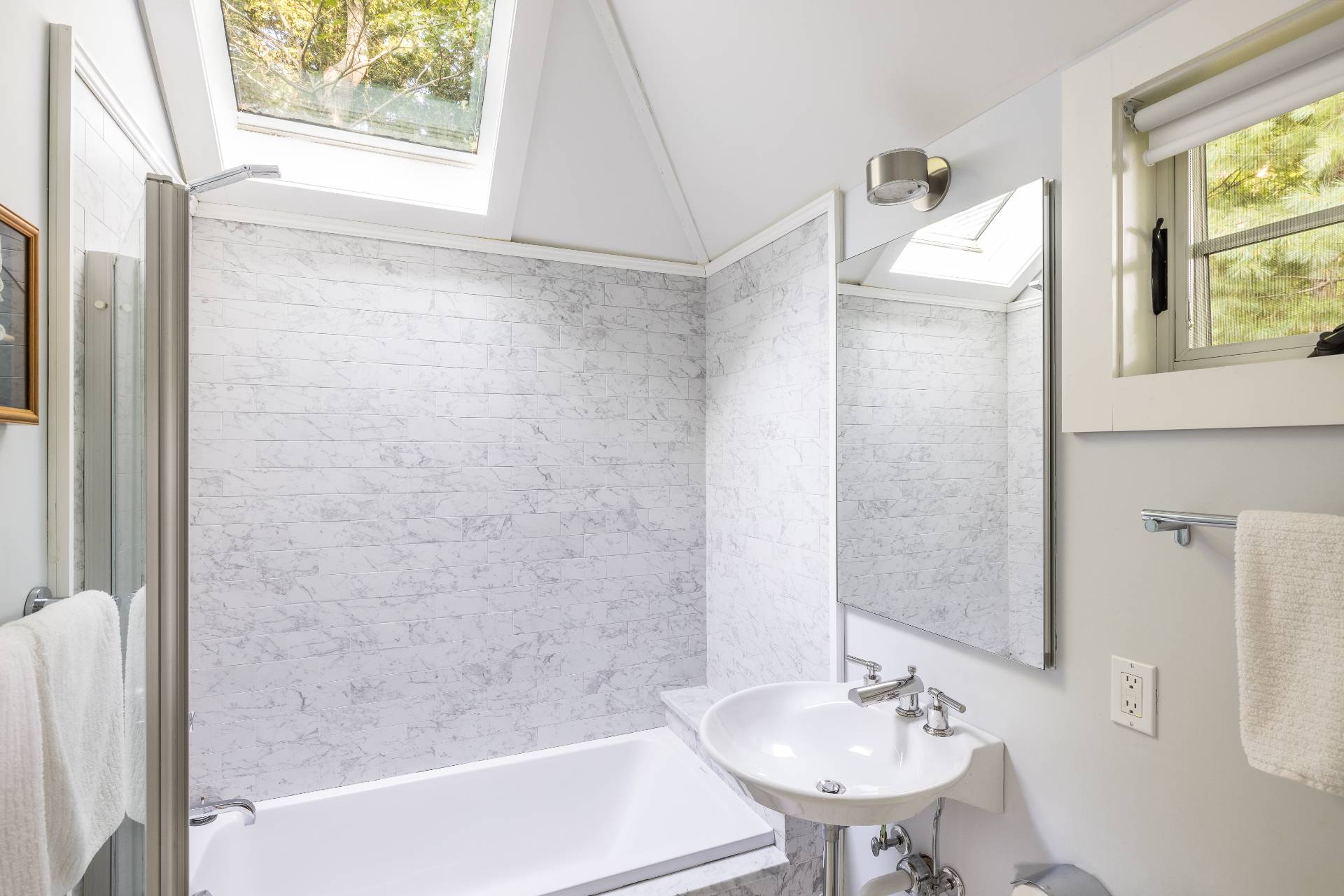 1333 Sagg Road Sag Harbor, NY 11963 - Photo 21 of 29 a bathroom with a sink a mirror and a bathtub