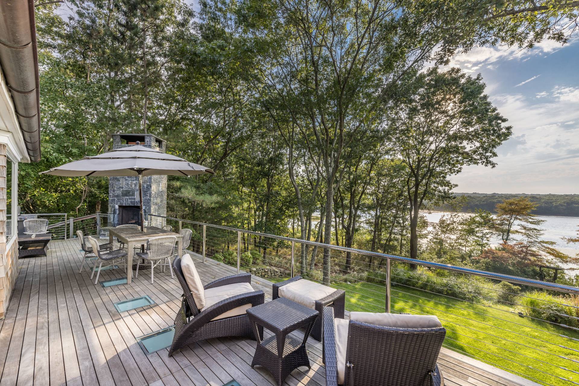 1333 Sagg Road Sag Harbor, NY 11963 - Photo 6 of 29 a view of a chair and tables on the roof deck