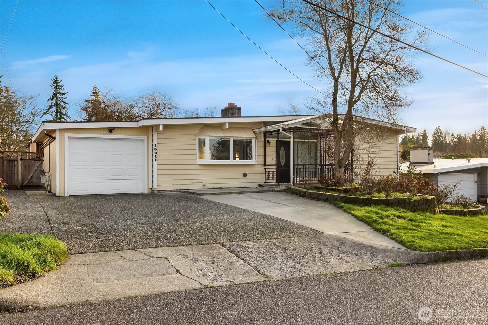 15411 Southeast 8th Street Bellevue, WA 98007 - Photo 1 of 24 front view of a house with a yard