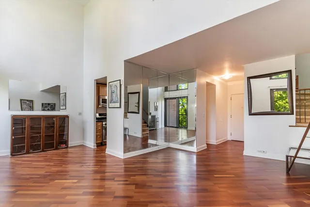 a view of an entryway with wooden floor and windows