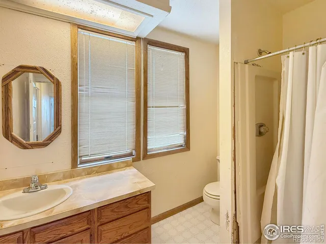 a bathroom with a sink a mirror and a shower