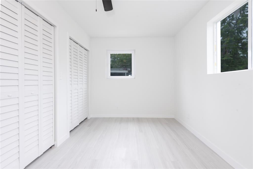 713 Southwest 4th Court Hallandale Beach, FL 33009 - Photo 13 of 38 an empty room with a window