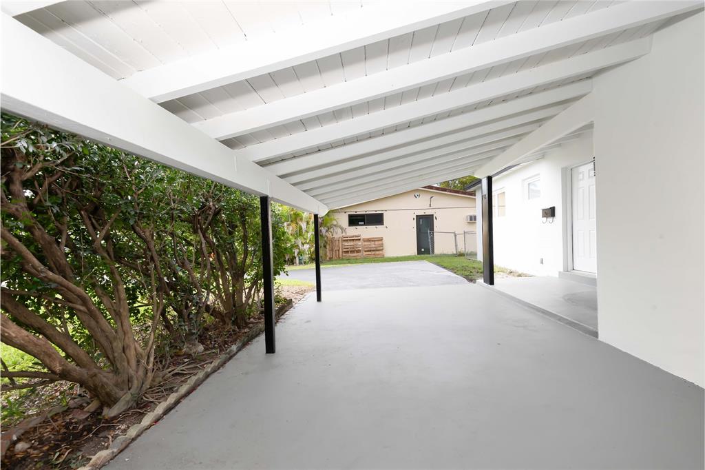713 Southwest 4th Court Hallandale Beach, FL 33009 - Photo 15 of 38 a view of a porch with hardwood